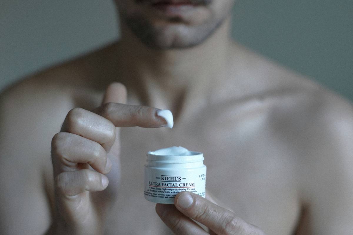 Man using male skin care face wipes after workout for quick cleansing